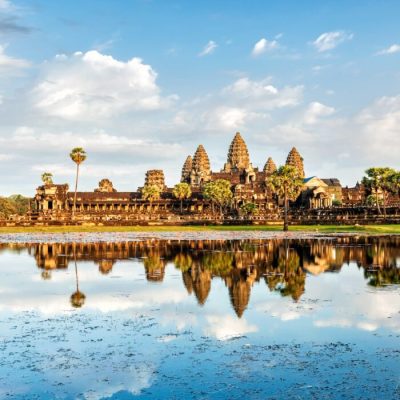 Cambodian landmark Angkor Wat with reflection in water on sunset. Siem Reap, Cambodia