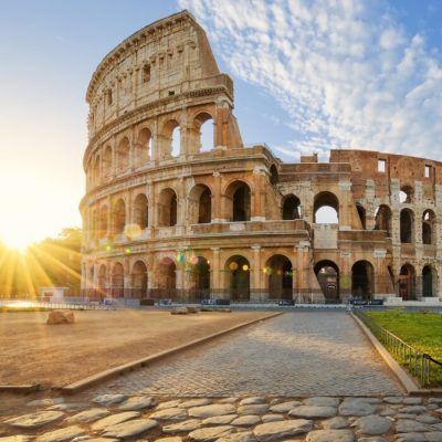 View of Colosseum in Rome and morning sun, Italy, Europe.