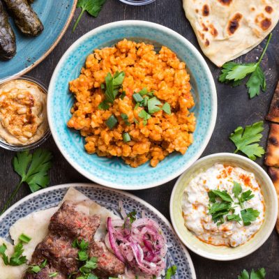 Traditional assorted turkish dishes. Turkish pizza meat kebab pita bulgur fried meatballs hummus and turkish meze set. Middle eastern dinner. Food party. Turkish cuisine. Top view. Eastern food